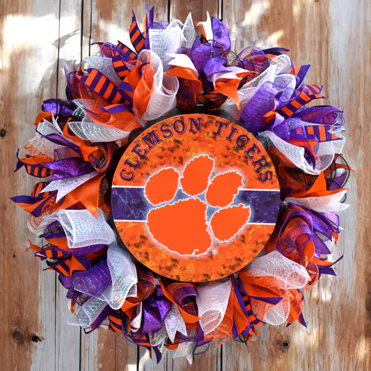 an orange and purple wreath with the clemson tigers on it