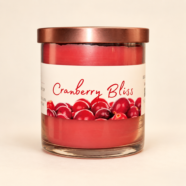 Cranberry Bliss candle by Lit Apothecary in a glass jar with copper lid and cranberry label