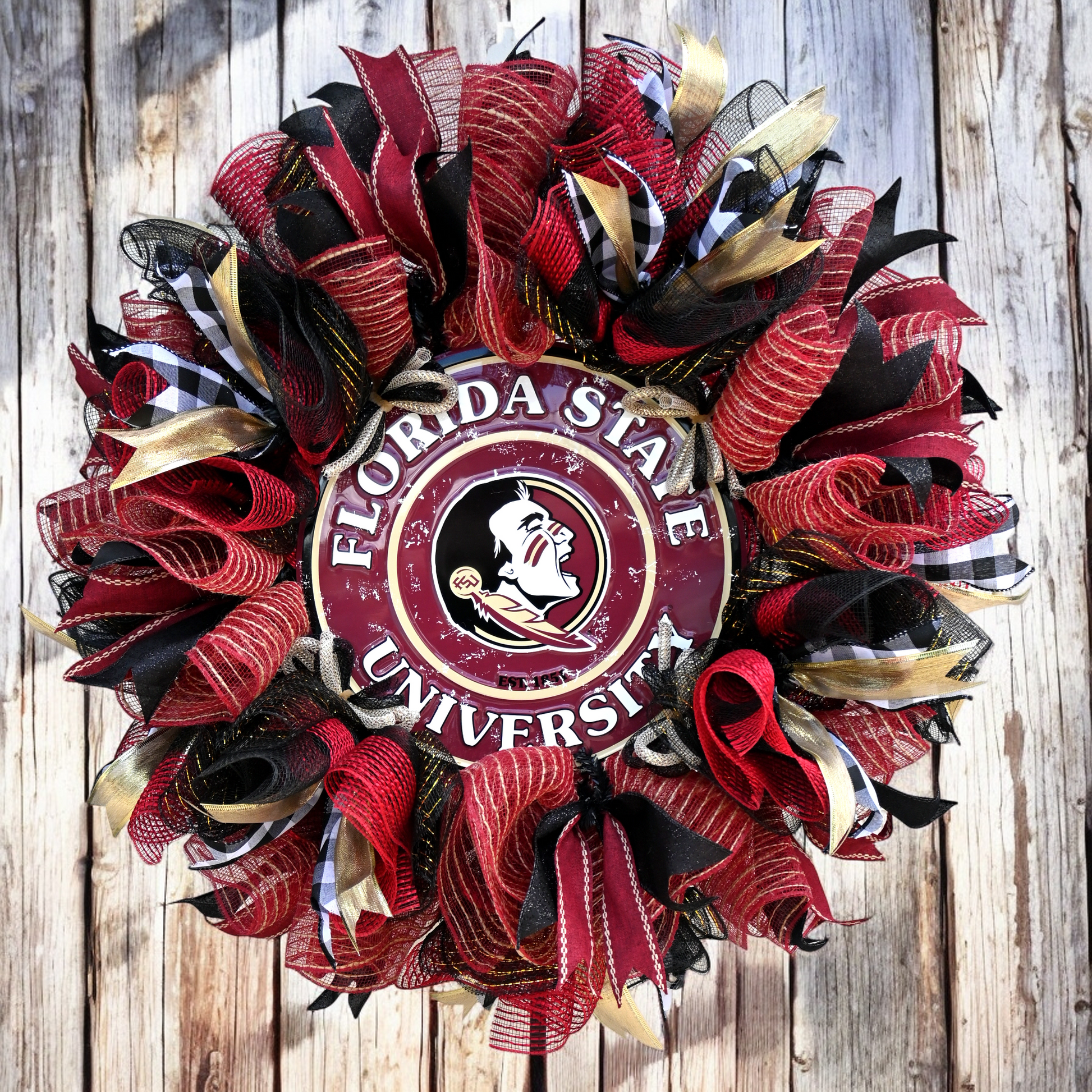 a florida state university wreath on a wooden wall