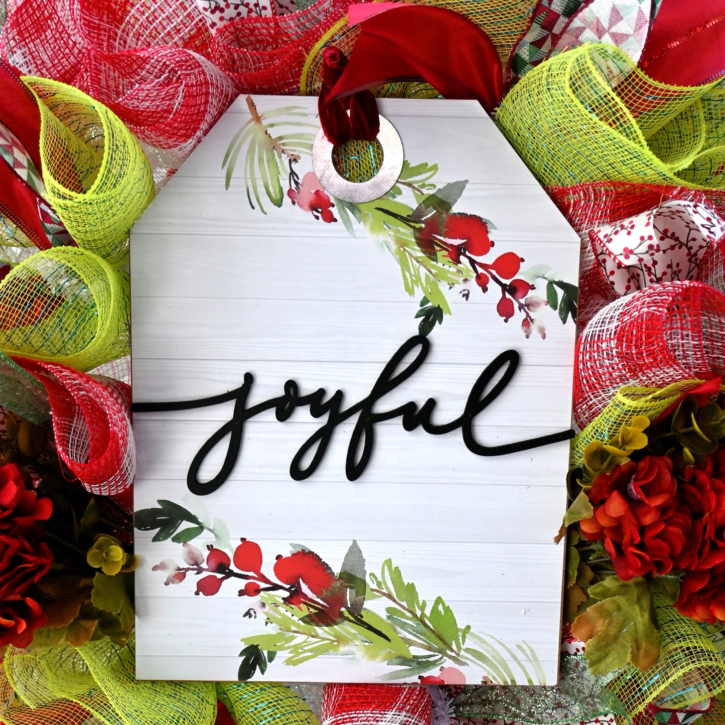 a wreath with the word joyful written on it