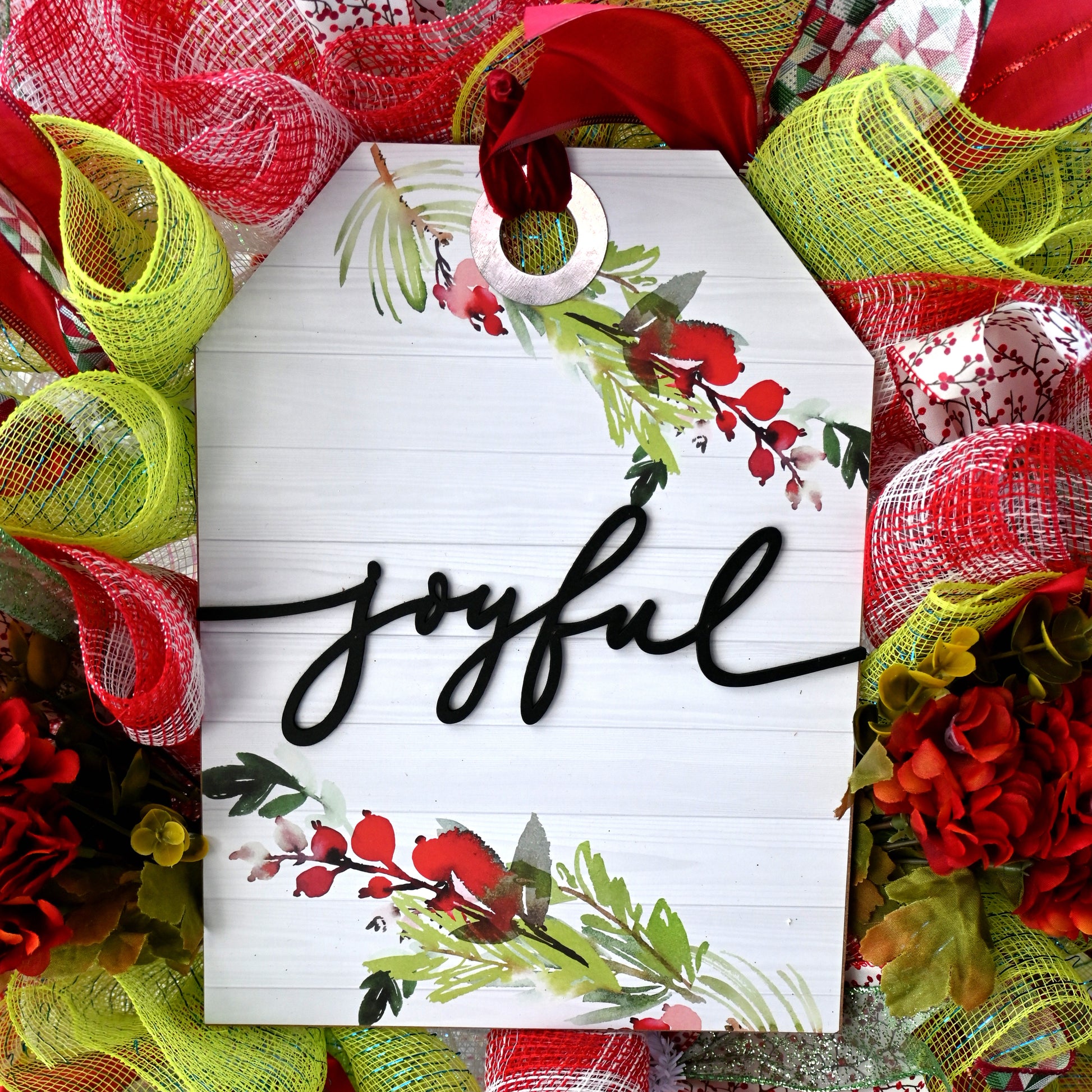 a wreath with the word joyful written on it