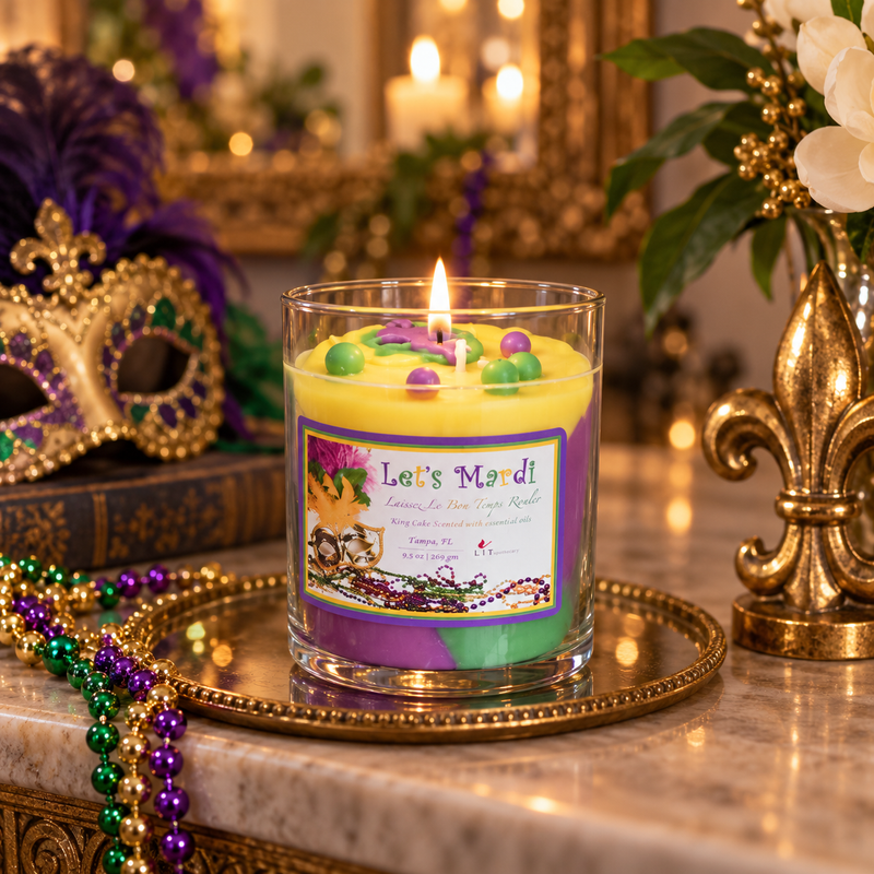 Mardi Gras King Cake Candle displayed with purple, green and gold New Orleans party décor