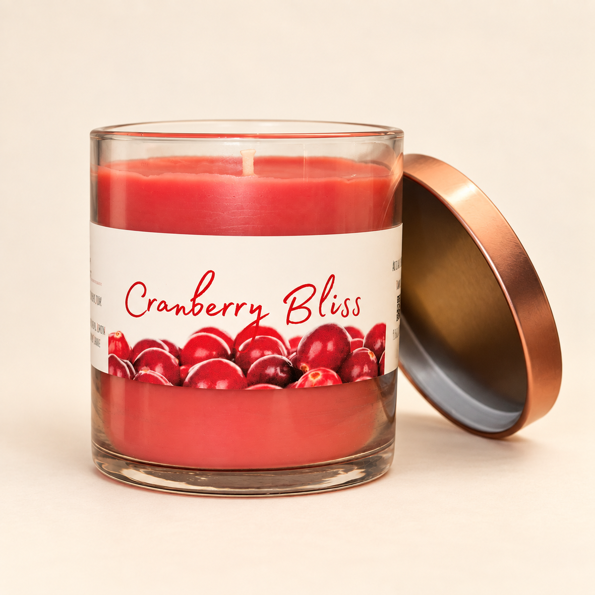 Open Cranberry Bliss candle showing red wax and wick with copper lid beside the jar