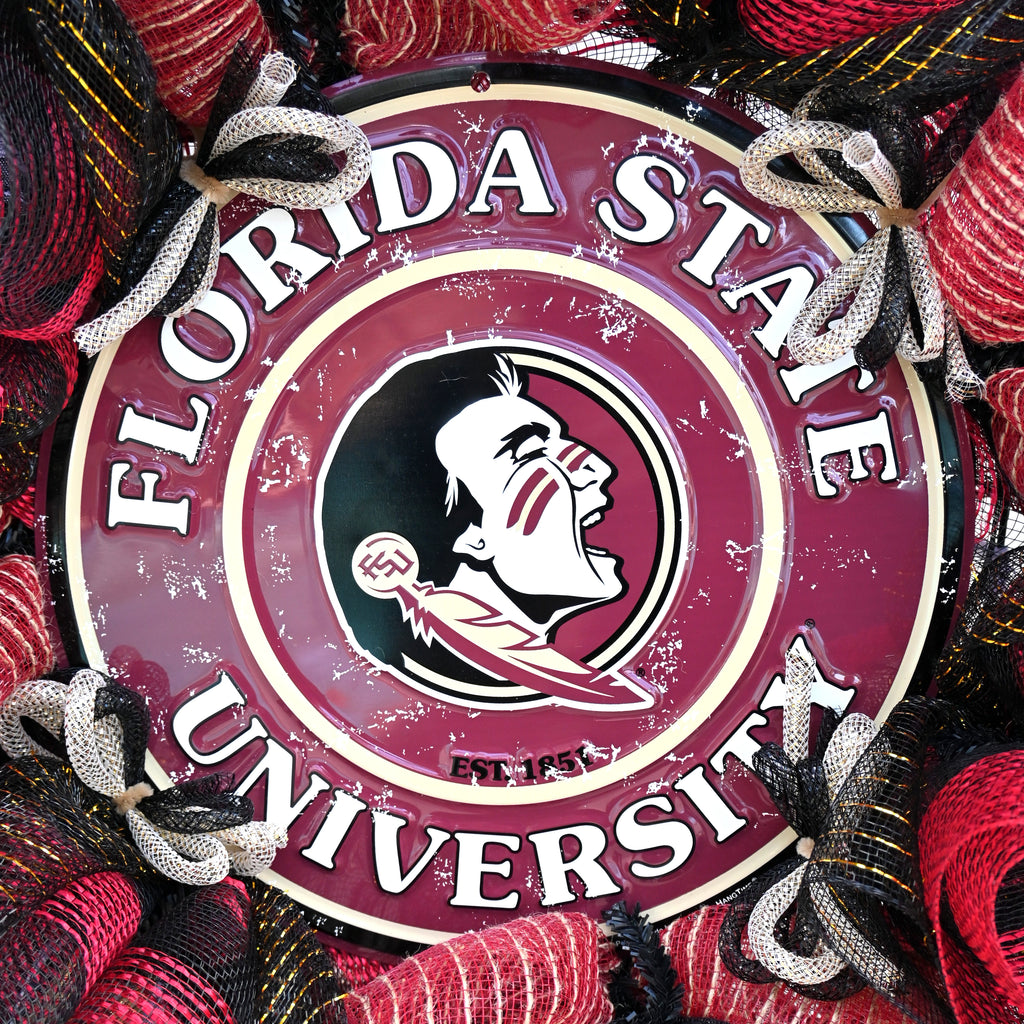 a florida state university sign is surrounded by red and black yarn