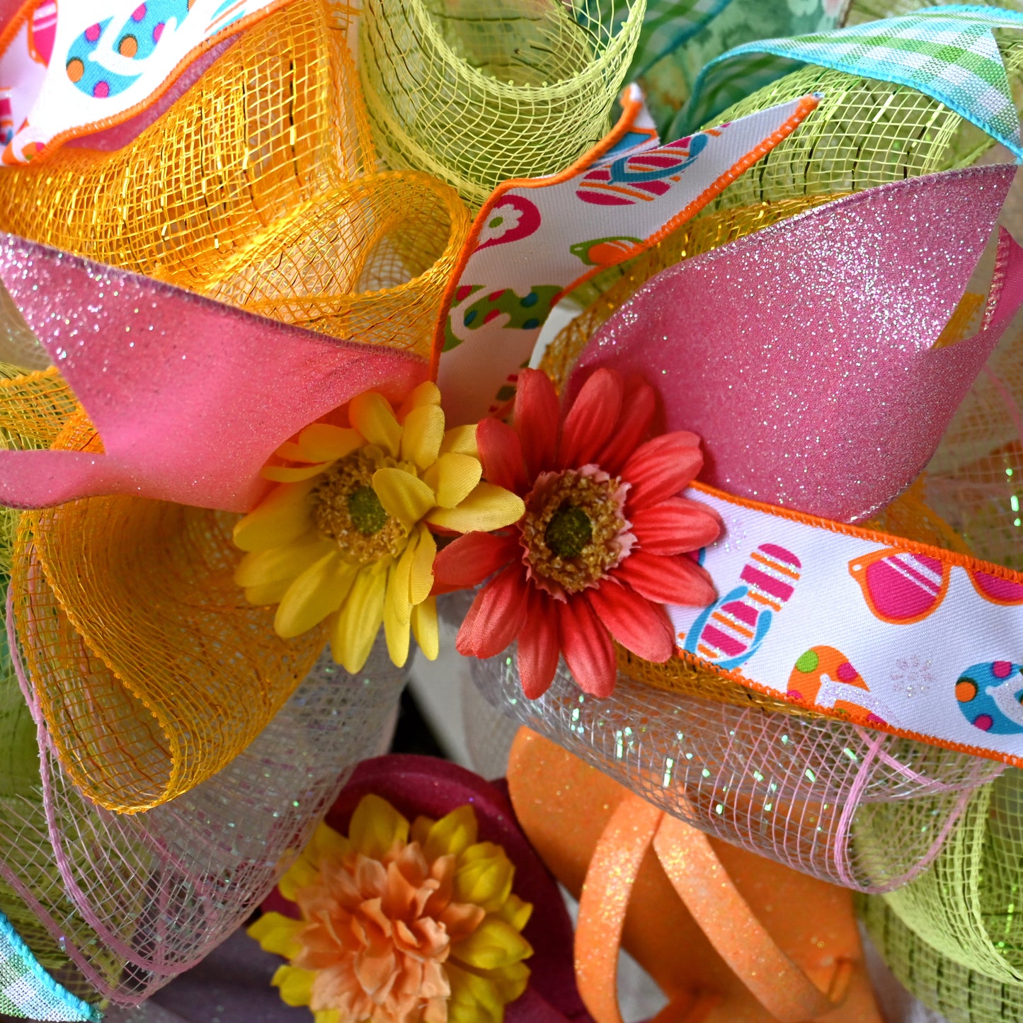 a close up of a wreath with flowers on it