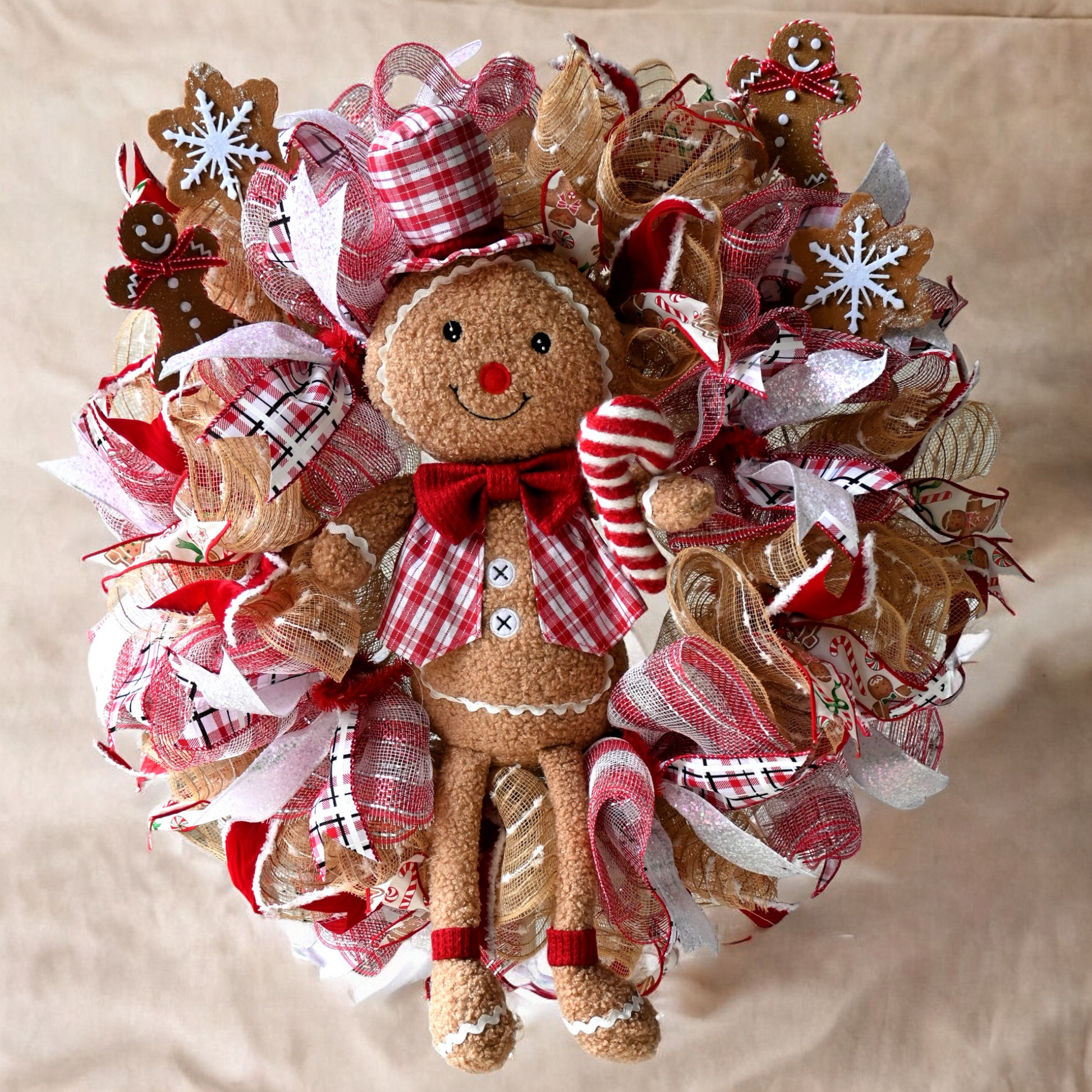 a christmas wreath with a gingerbread man on it