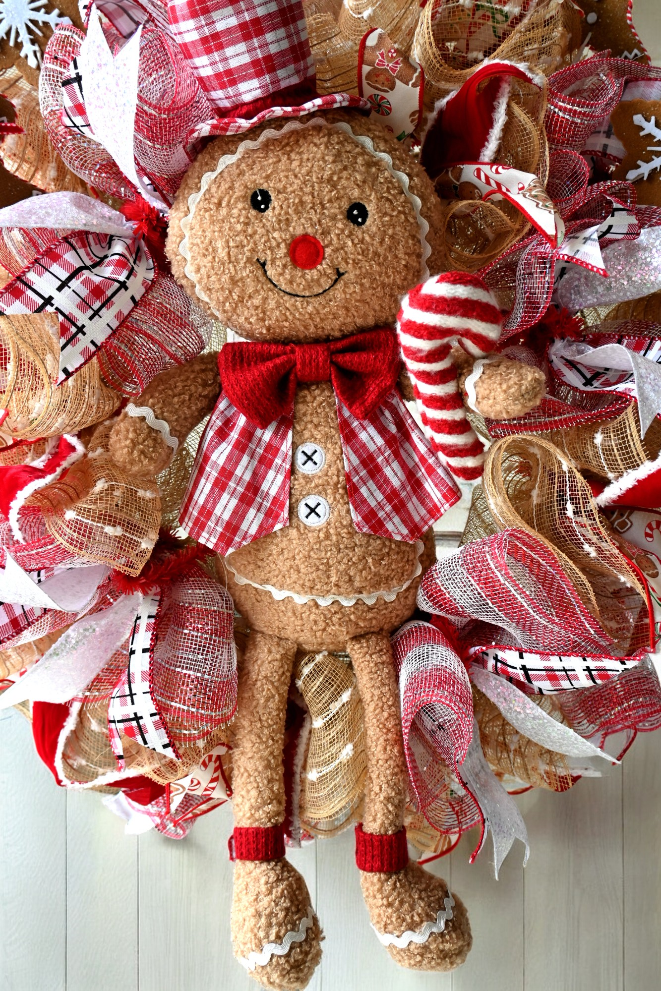 a christmas wreath with a gingerbread man on it