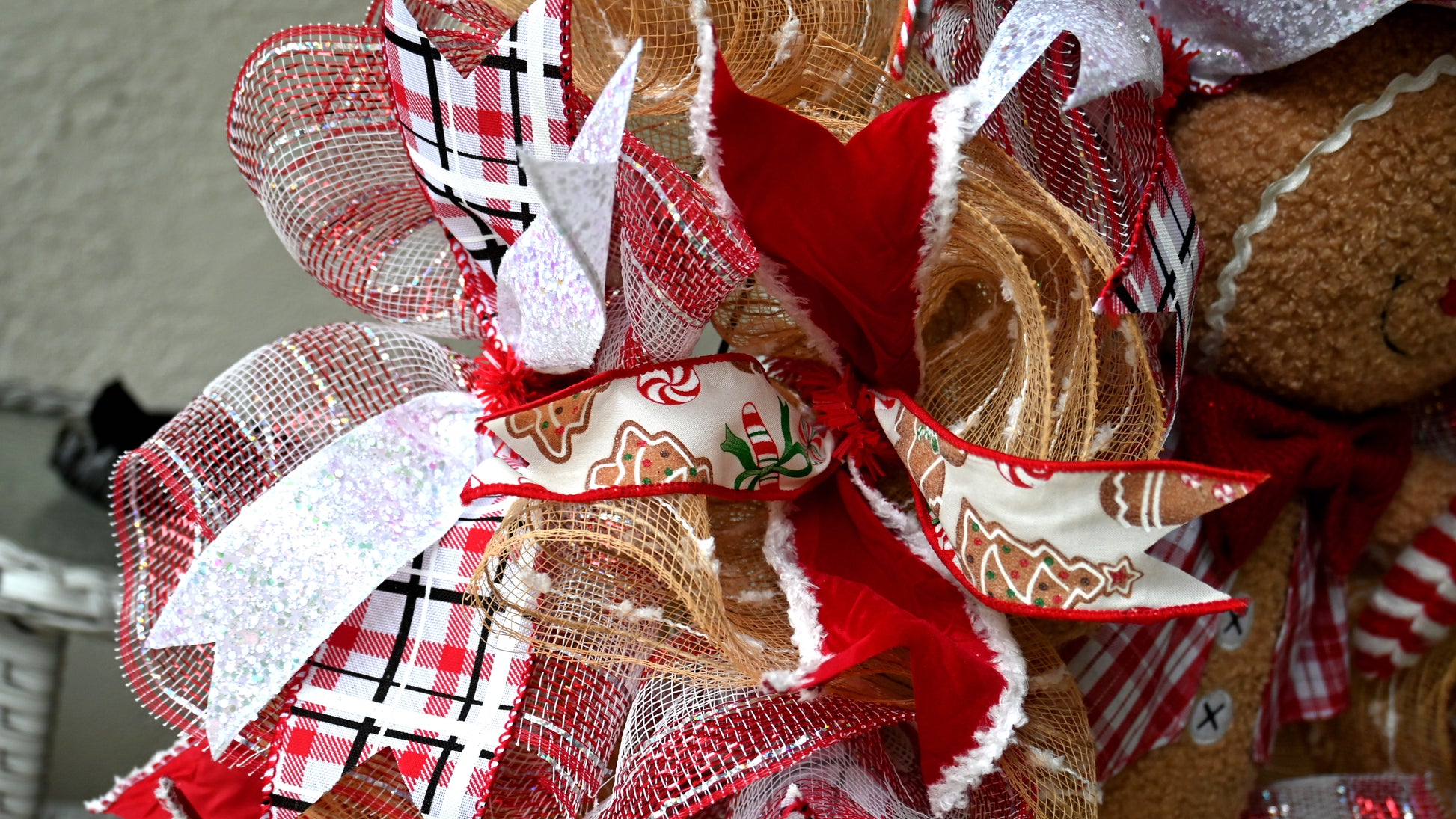 a close up of ribbons for a gingerbread man wreath