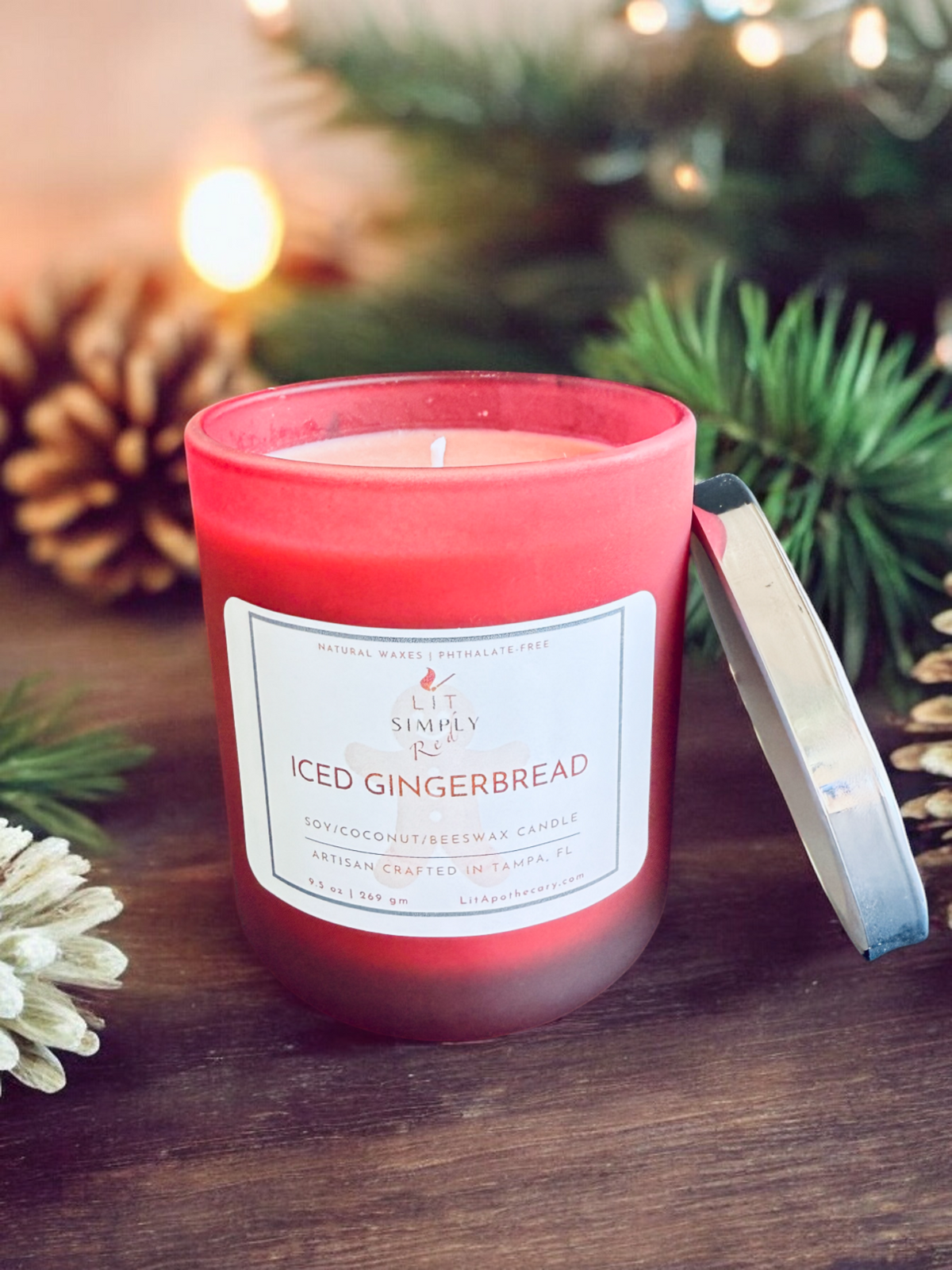 Open Iced Gingerbread candle with warm gingerbread, sweet sugar and creamy vanilla fragrance in a red holiday candle jar.