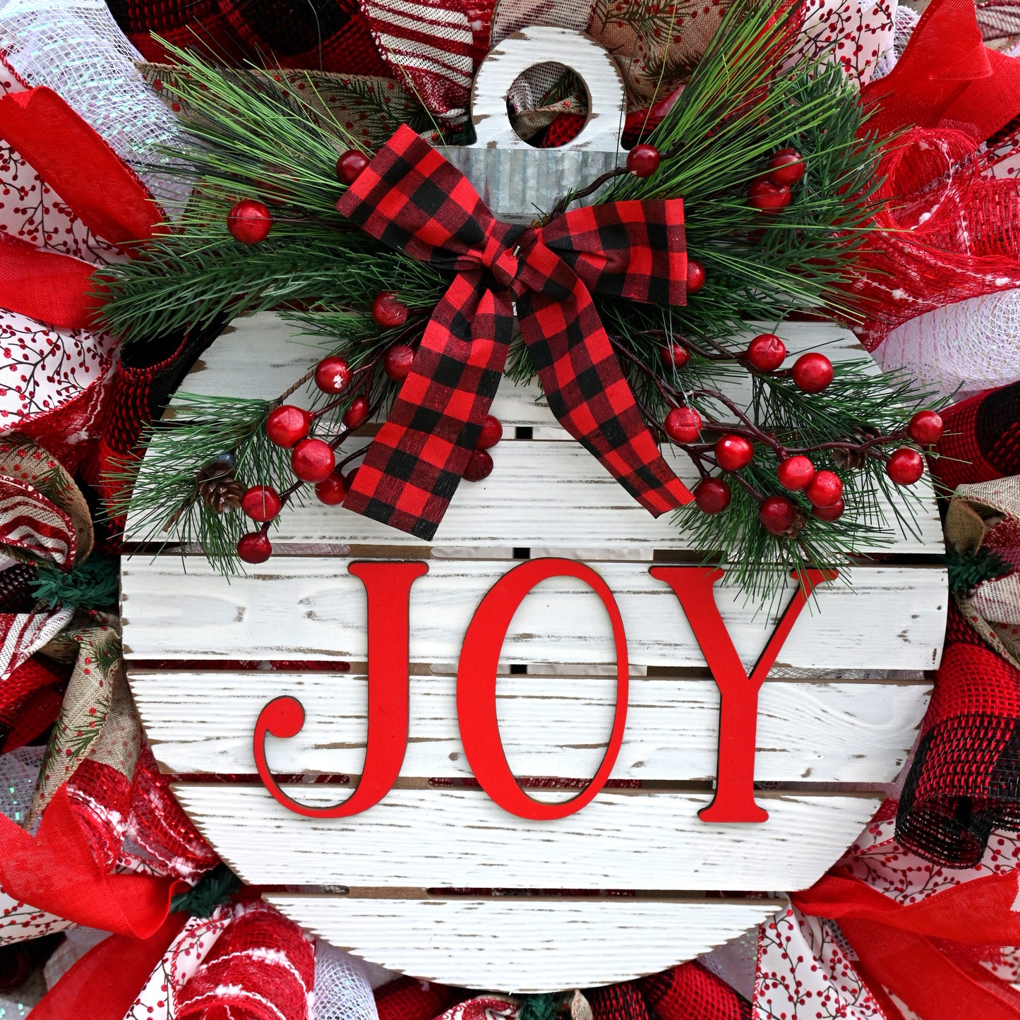 Joy Wreath - Ornament Wreath - Detailed look at the vibrant ribbons and accents on this joy ornament wreath, ideal for the holiday season.