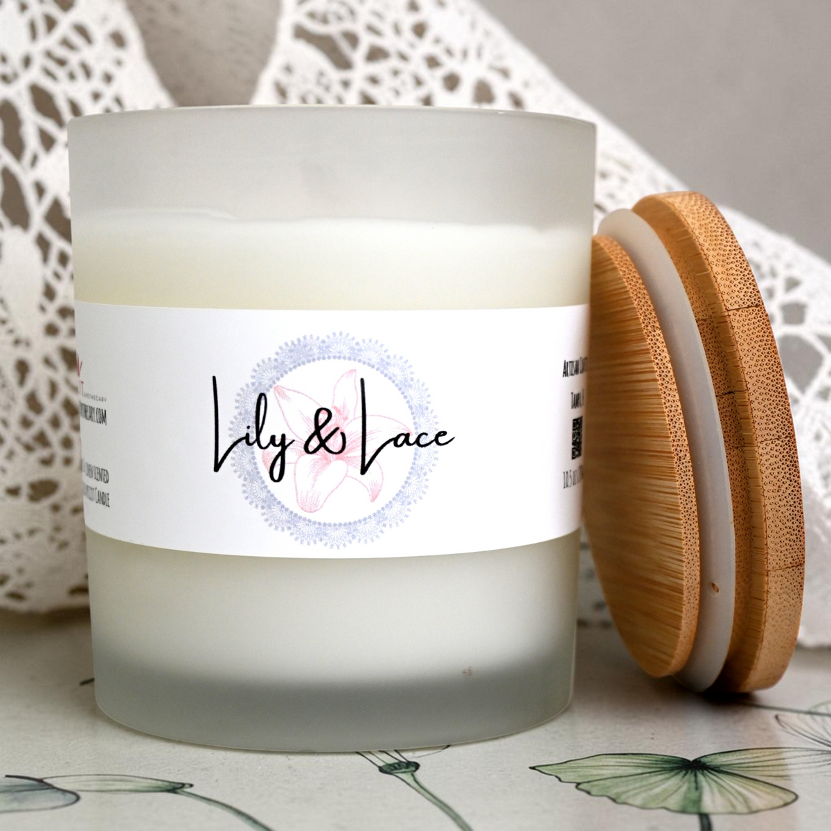 Open Lily & Lace candle in frosted glass jar with bamboo lid beside it