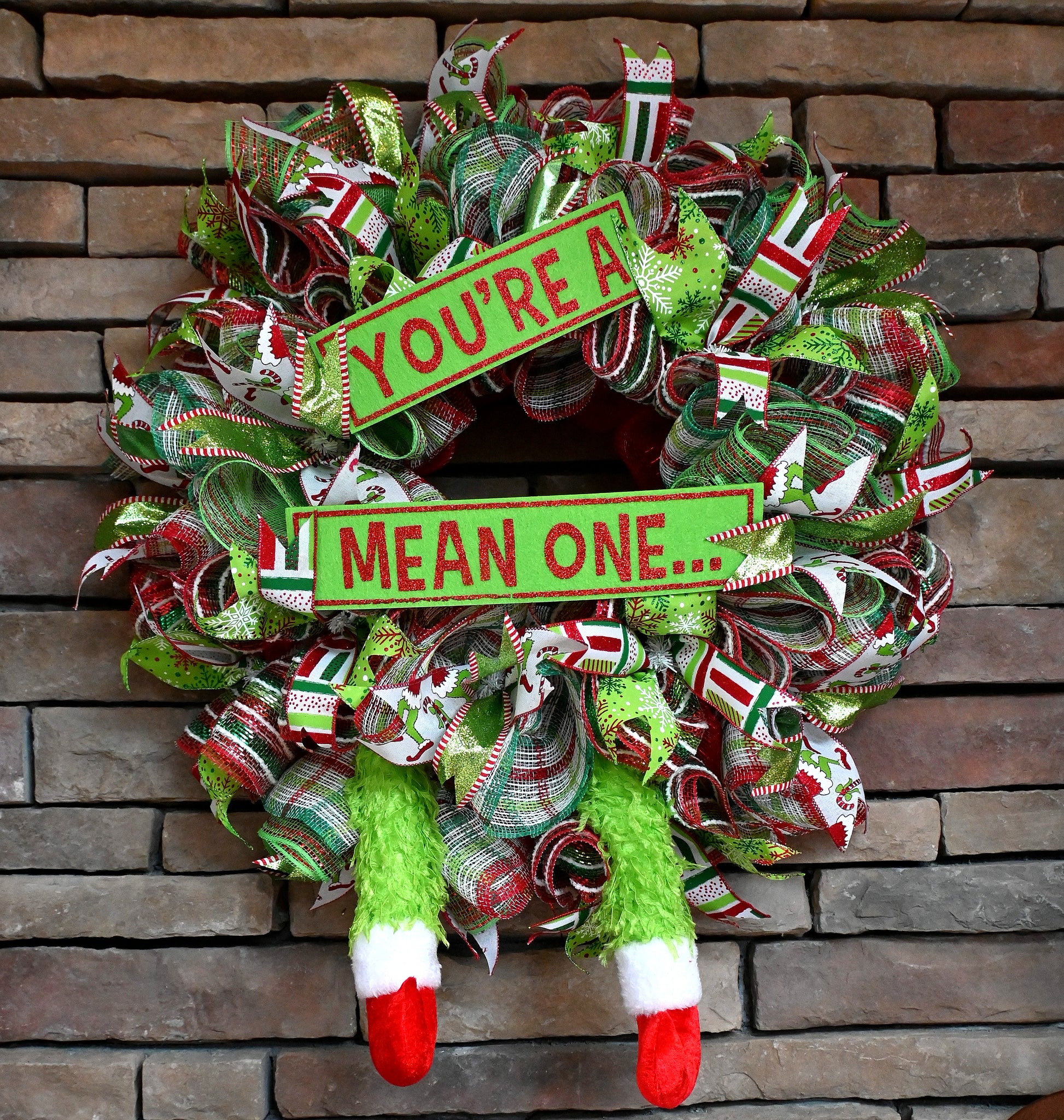 a christmas wreath that says you're a mean one