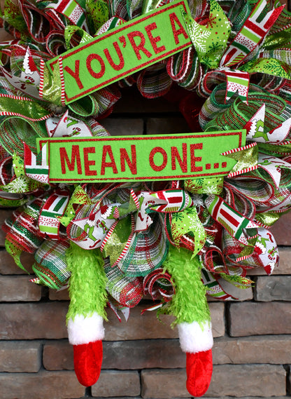 a christmas wreath that says you're a mean one