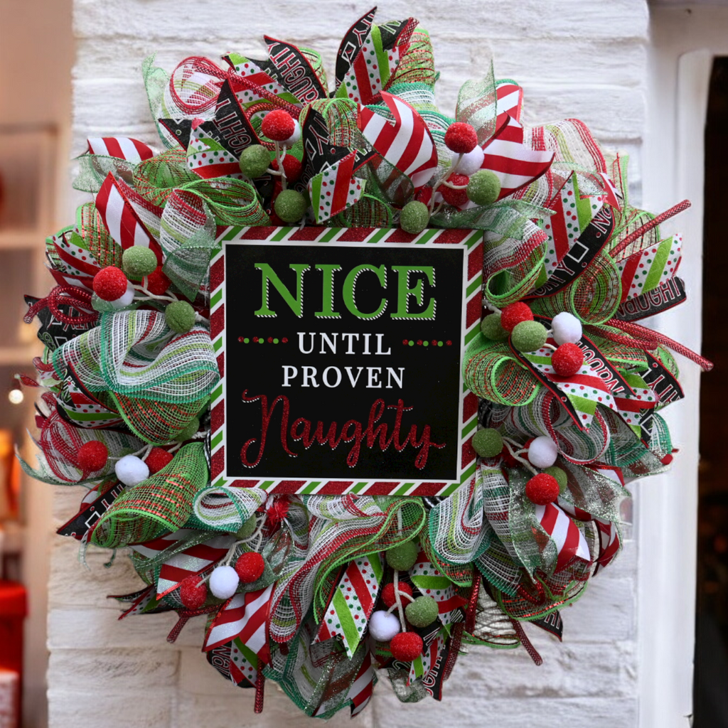 Nice Until Proven Naughty Christmas wreath with red, lime green and white holiday ribbons