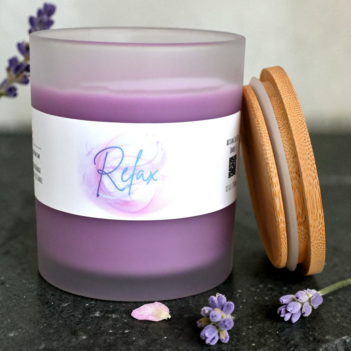 Open Relax lavender orange candle in frosted glass with bamboo lid beside the jar