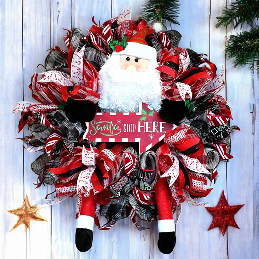 a christmas wreath with a santa clause on it