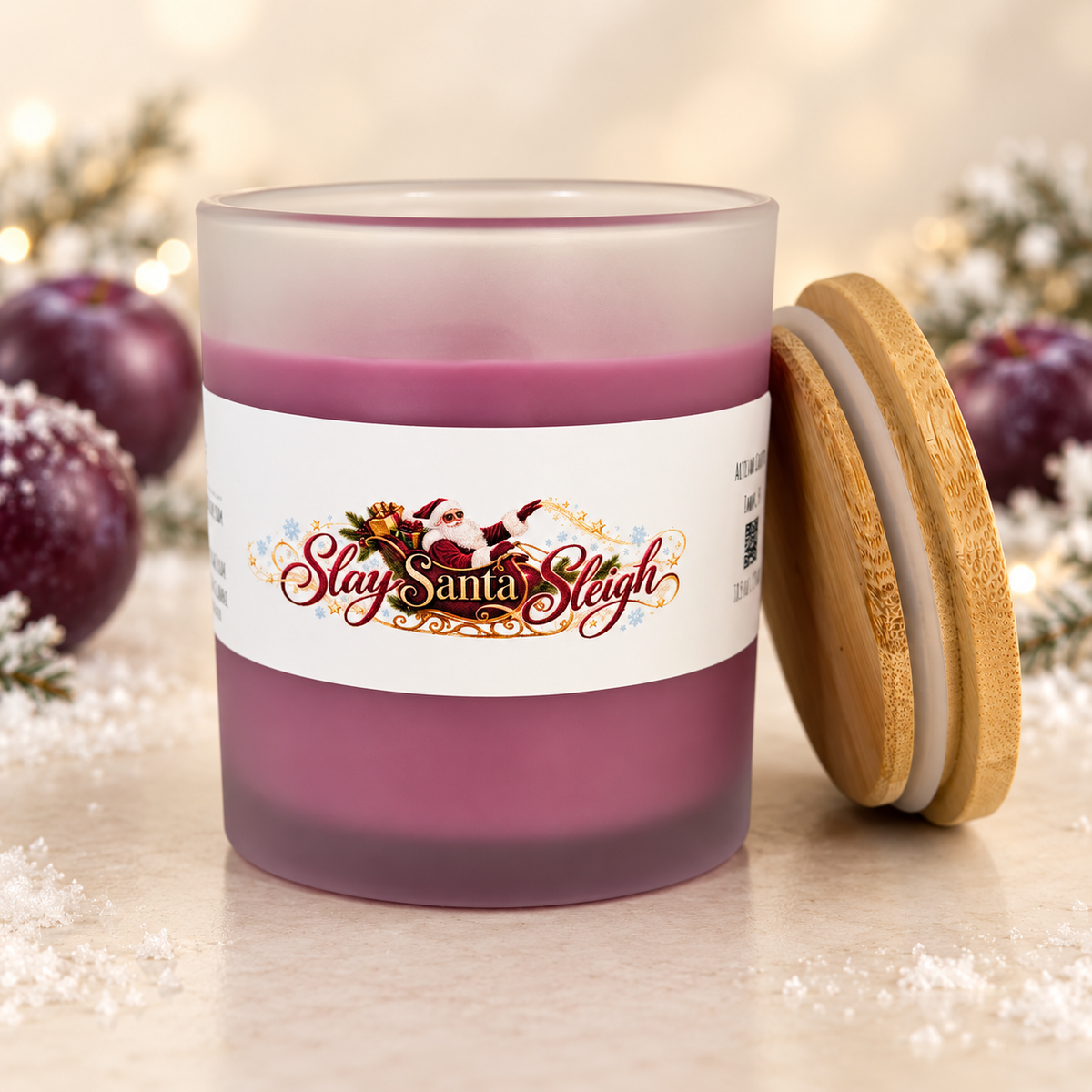 Open Slay Santa Sleigh Frosted Sugar Plum candle with bamboo lid beside the frosted plum jar.