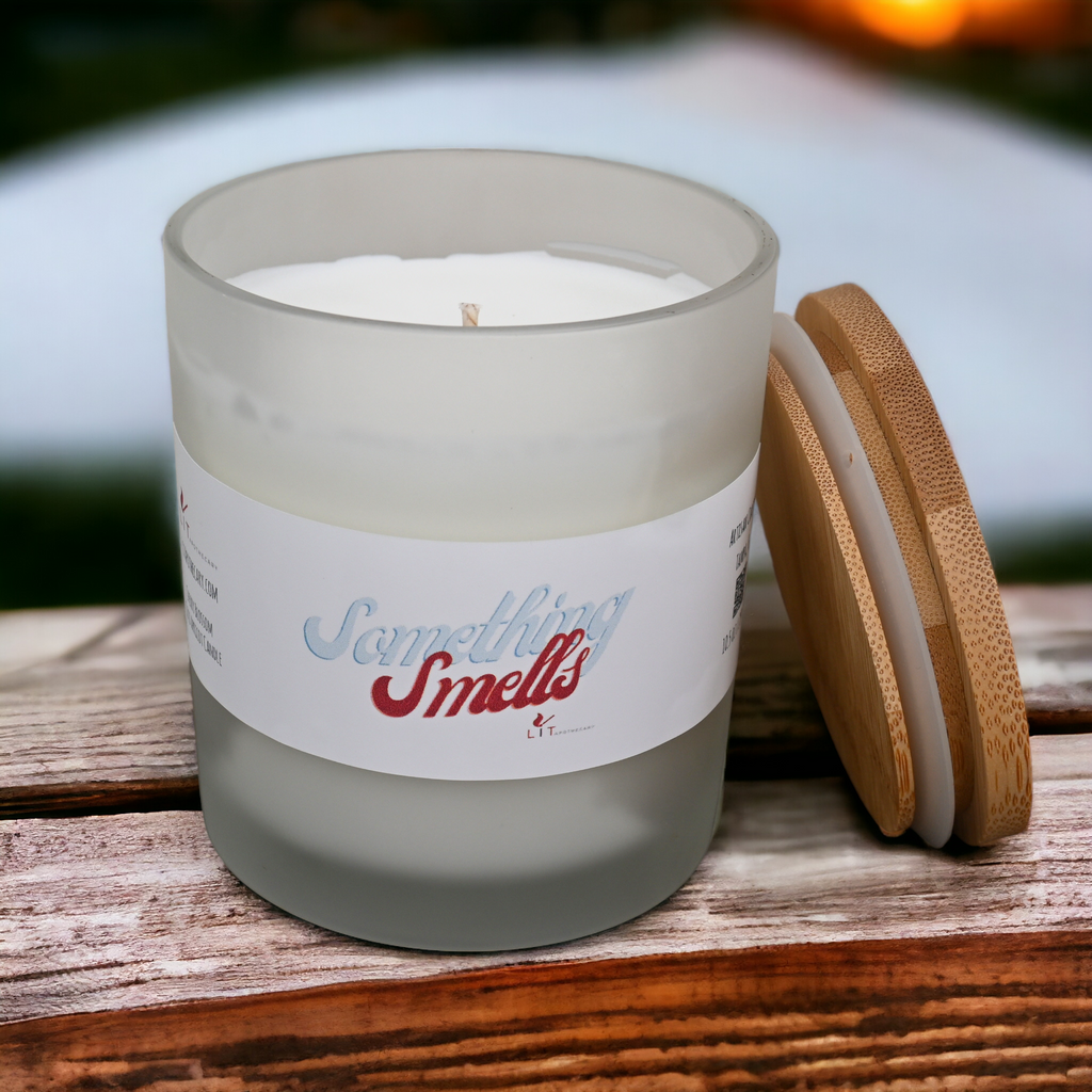 Open Something Smells cherry blossom candle showing white wax and wick beside bamboo lid