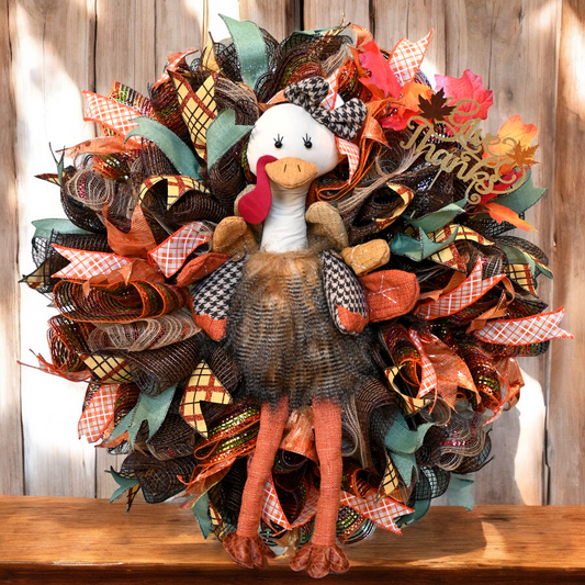 a wreath with a turkey on top of it