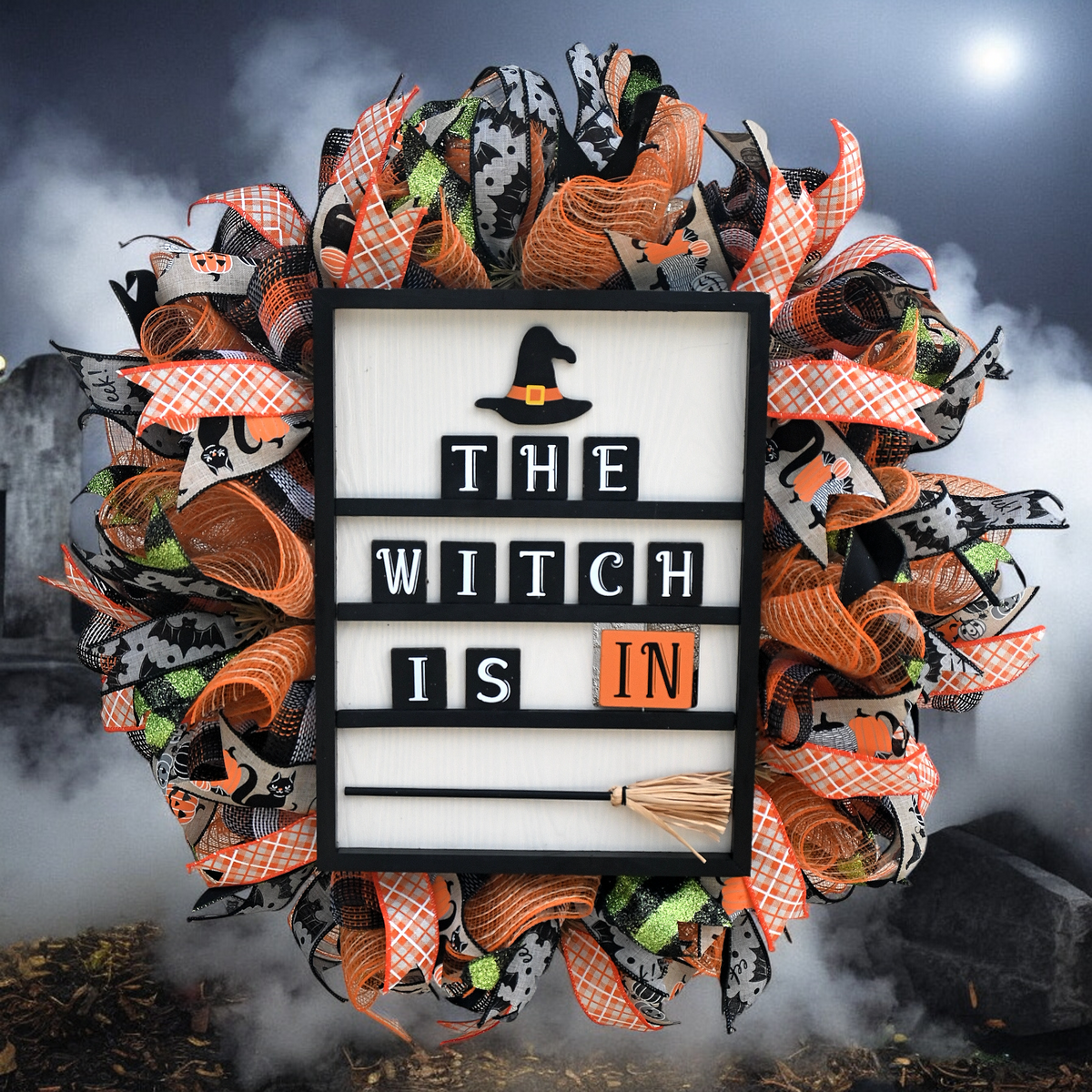 Handmade Witch Is In Halloween wreath with orange, black and white mesh, reversible witch sign, and festive front door ribbons.