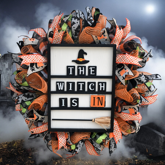 a halloween wreath with the words the witch is in