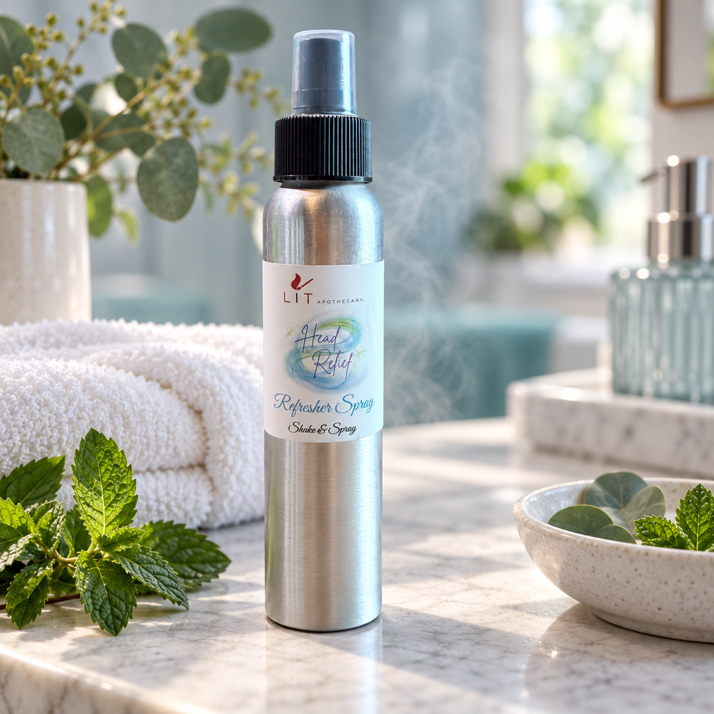 Head Relief room spray displayed with fresh mint, eucalyptus, and folded towels in a bright spa setting