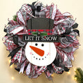Let It Snow snowman Christmas wreath with red, white and black ribbons and a wooden snowman centerpiece