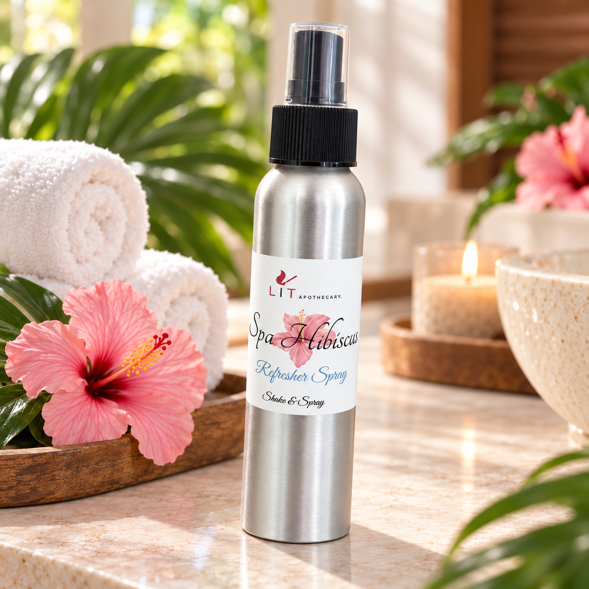 Spa Hibiscus room spray in a relaxing tropical spa setting with towels, hibiscus and greenery