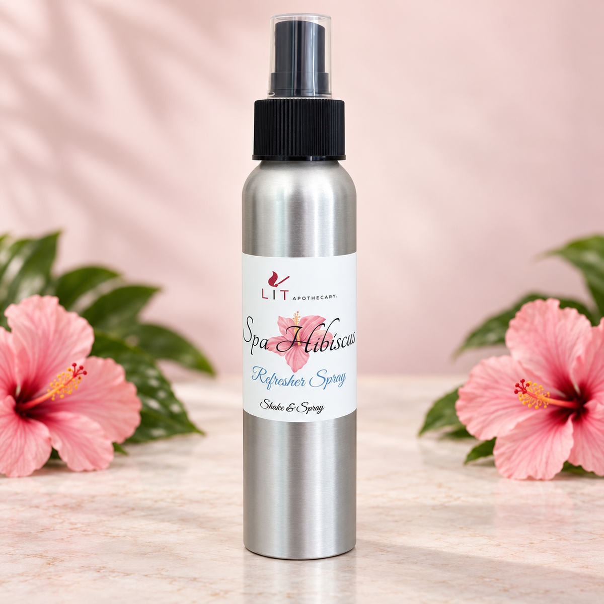 Lit Apothecary Spa Hibiscus room spray with pink hibiscus flowers and tropical greenery