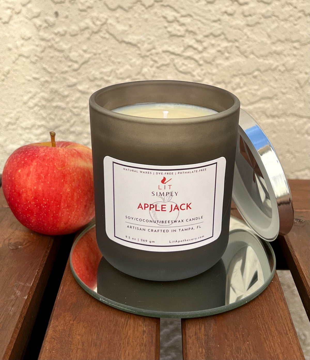Apple Jack apple spice candle in a decorative jar with diamond-style metal lid for cozy fall home fragrance.
