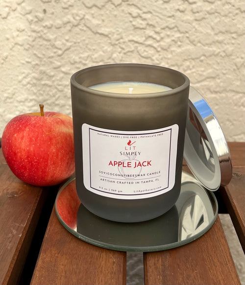 Apple Jack apple spice candle in a decorative jar with diamond-style metal lid for cozy fall home fragrance.