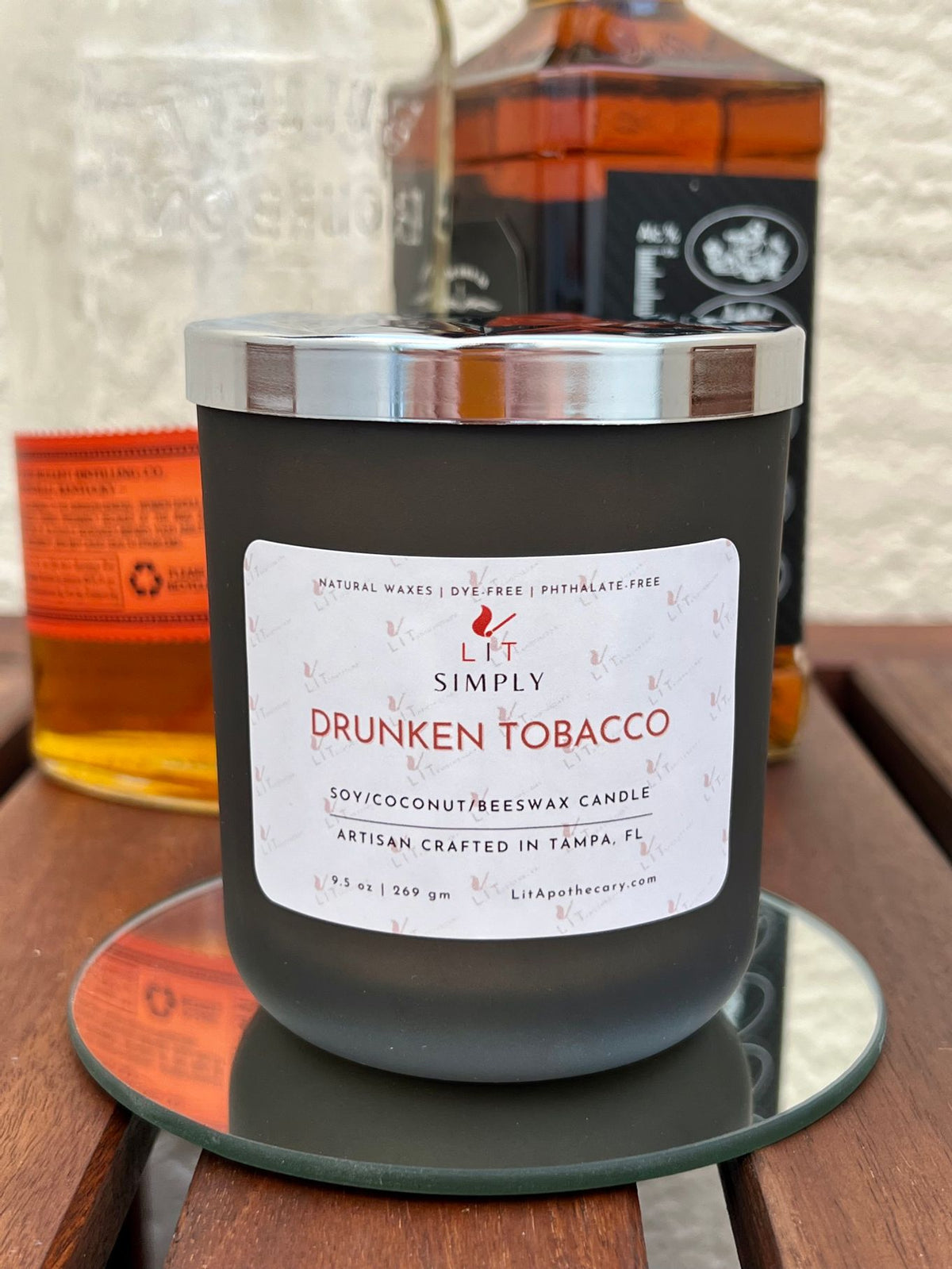 Drunken Tobacco candle in decorative jar with smoky tobacco, Kentucky bourbon, and wooden wick fall fragrance.