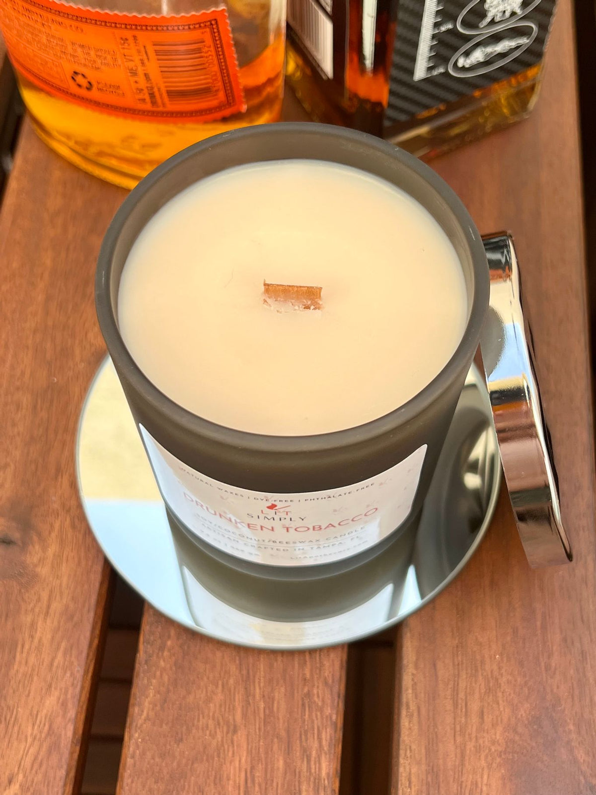 Top view of Drunken Tobacco wooden wick candle in a decorative jar.
