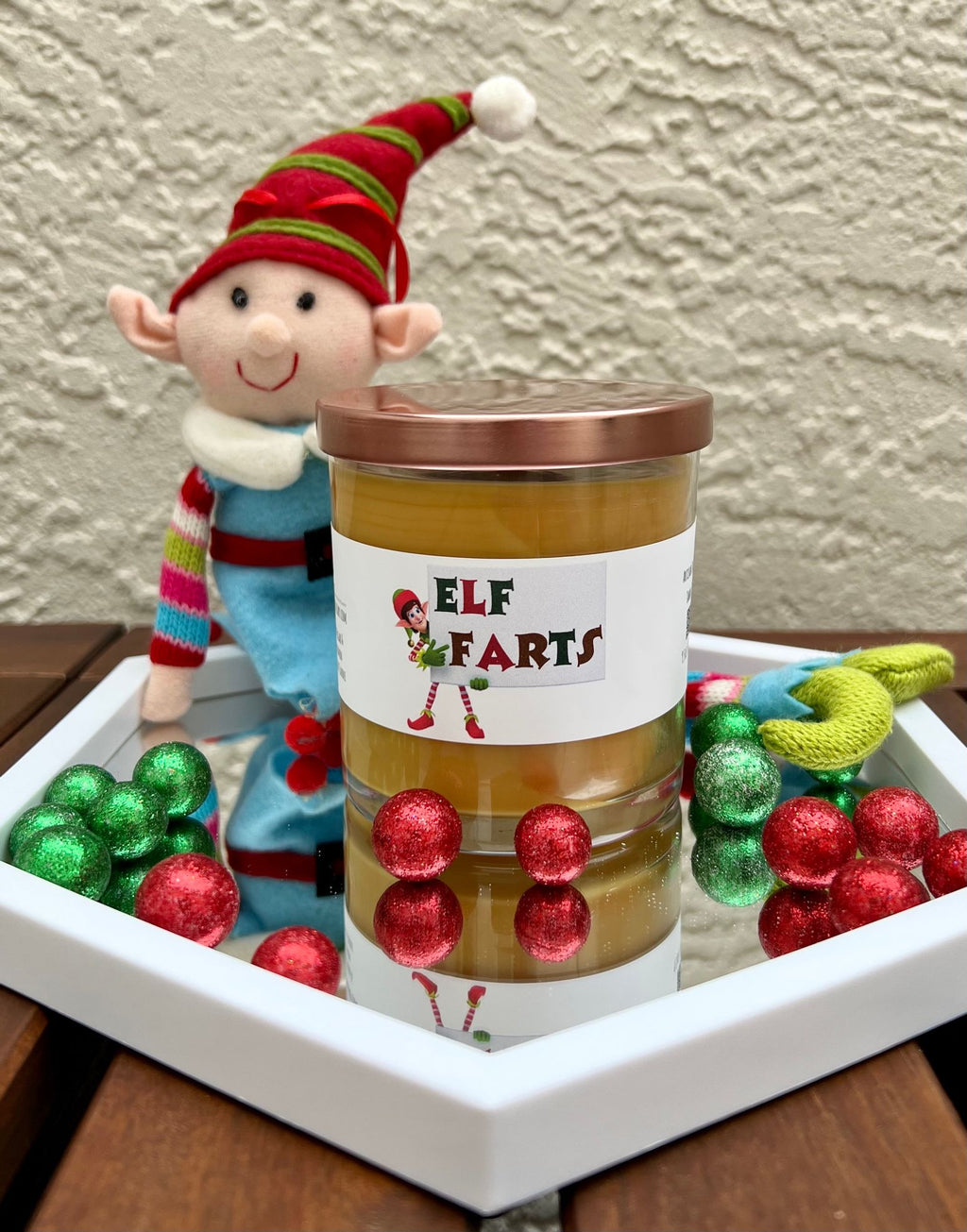 Closed Elf Farts Christmas candle with brown sugar and cinnamon fragrance, shown with its lid for festive holiday gifting.