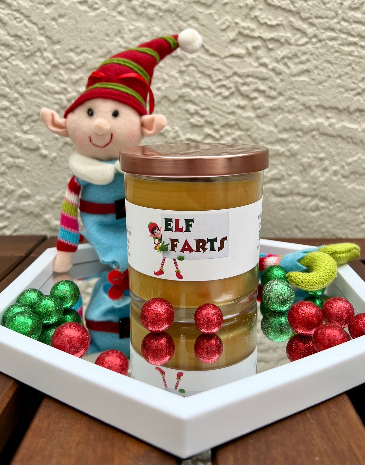 Closed Elf Farts Christmas candle with brown sugar and cinnamon fragrance, shown with its lid for festive holiday gifting.