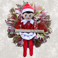 Believe in the Magic elf Christmas wreath with red, green and white holiday accents