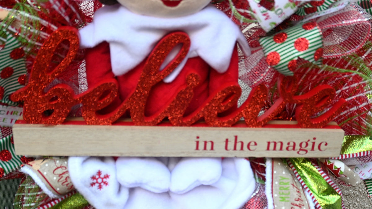 Close-up of the Believe in the Magic sign on the elf Christmas wreath