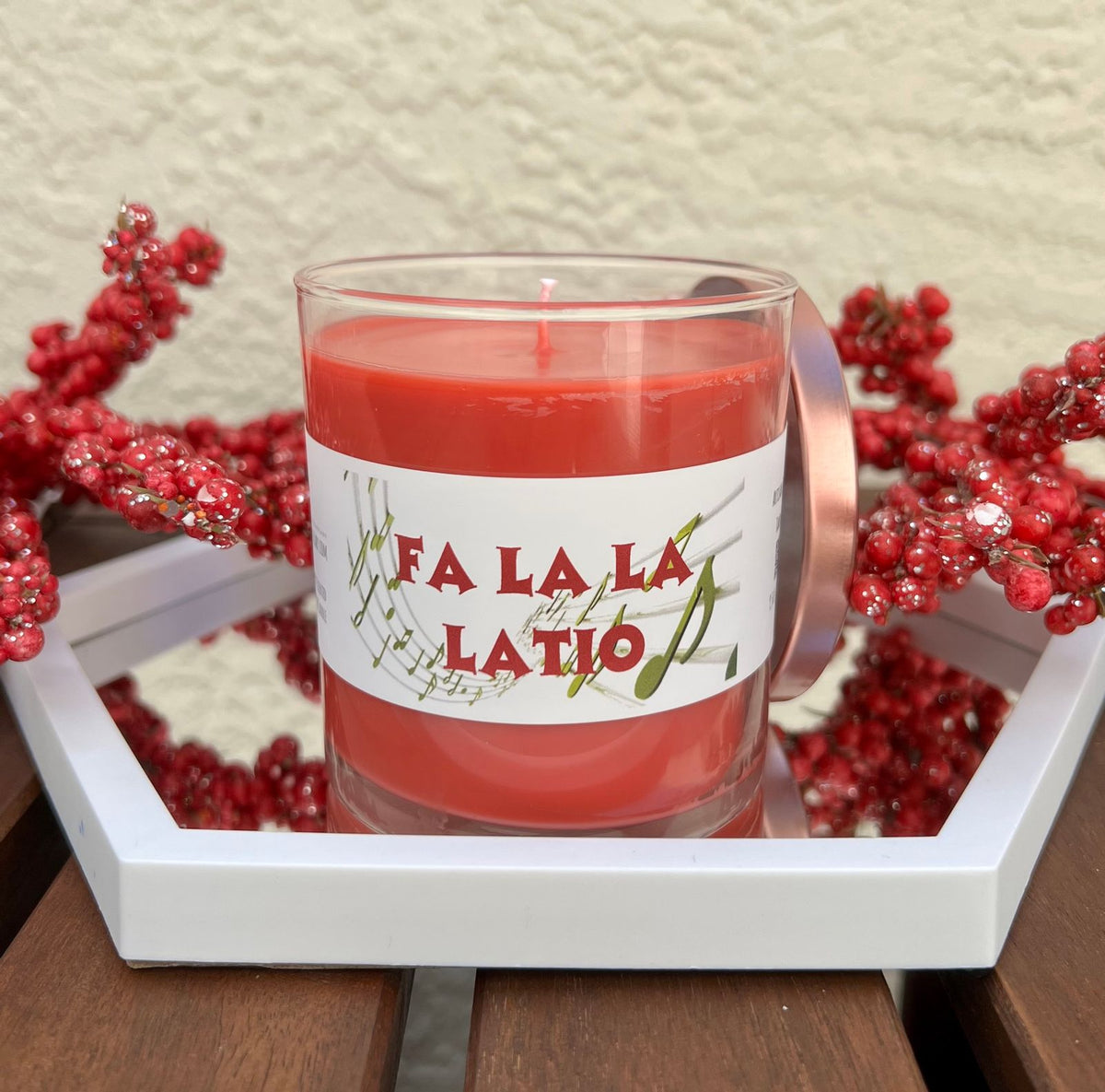 Open Fa La La La Latio cranberry Christmas candle with playful adult holiday humor.