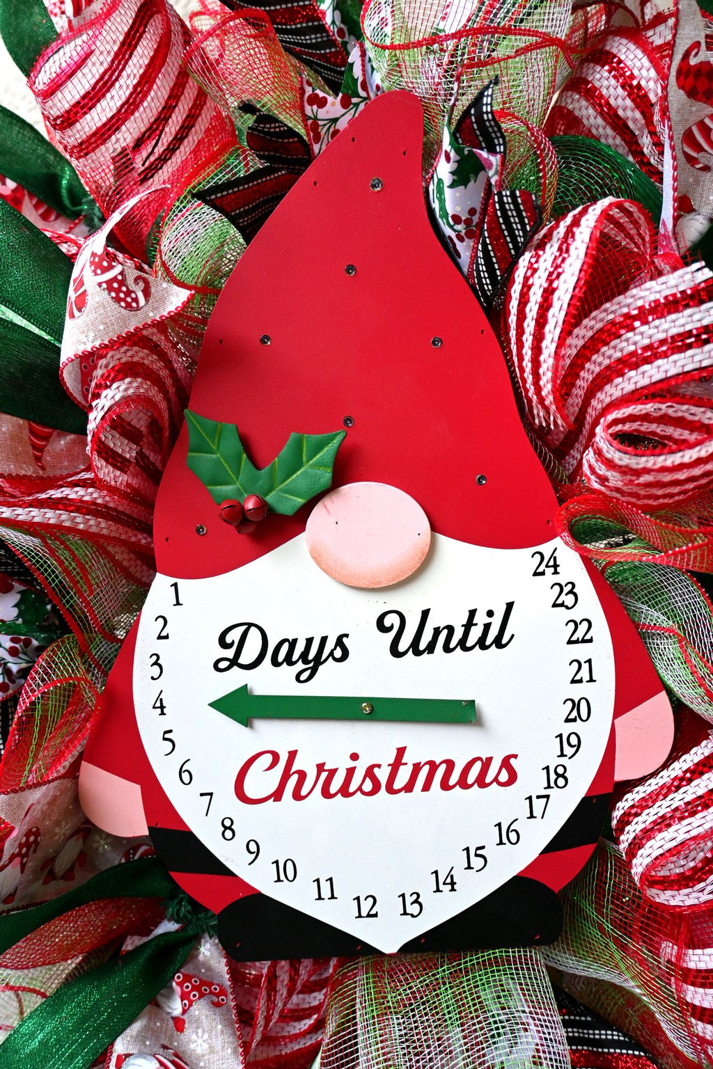 Close-up of the gnome Christmas countdown sign with movable arrow and lighted hat