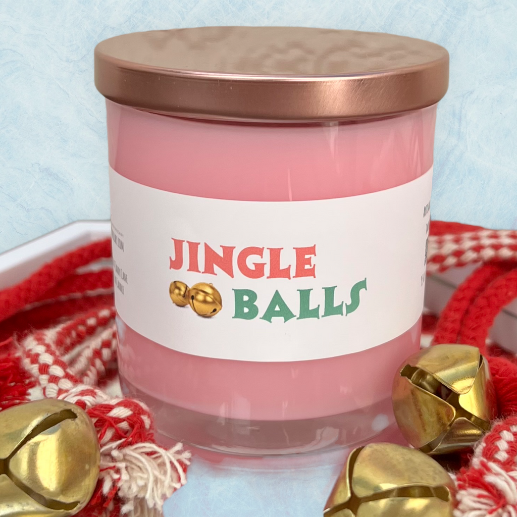 Jingle Balls peppermint candy cane Christmas candle with festive pink wax and playful holiday label.