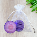 Lavender and orange shower steamers in mesh bag