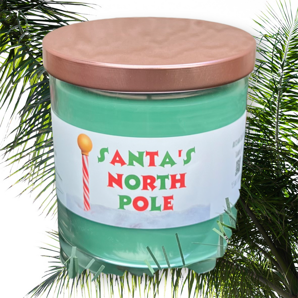 Santa North Pole evergreen spice Christmas candle with festive holiday label and seasonal home fragrance styling.