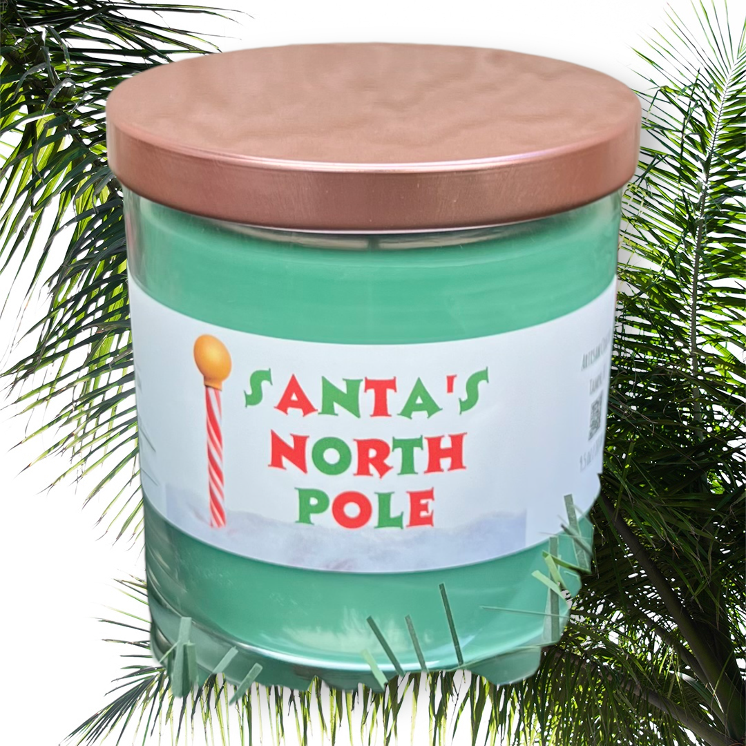 Santa North Pole evergreen spice Christmas candle with festive holiday label and seasonal home fragrance styling.