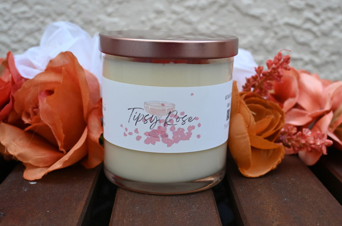 Closed Tipsy Rose wine and roses candle with rose-gold-tone lid and floral label